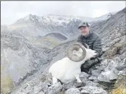  ?? Courtesy photo ?? Fred Sutton with the Dall sheep ram he killed in August hunting in the Brooks Range of northern Alaska. Sutton hiked more than eight miles and made a 220-yard uphill shot to bag the ram.