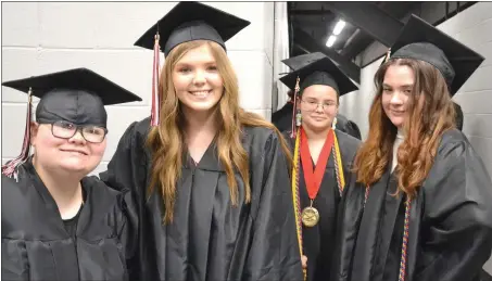  ?? Annette Beard/Pea Ridge TIMES ?? Graduating seniors Leanna Wingett, Jordan Wiltgen, Hannah Williams and Jaycee Wingett waited patiently in the hallway behind the arena Saturday afternoon before graduation ceremonies began. See page 1B for more.