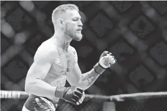  ?? ADAM HUNGER, USA TODAY SPORTS ?? When fighting in the MMA, Conor McGregor wears 4-ounce gloves with open fingers.