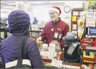  ?? Paul Buckowski / Times Union ?? Stewart’s Shops President Gary Dake checks out a customer at the Arbor Hill Stewart’s Shop in 2019 in Albany. Employees now own 40 percent of the company through its employee stock ownership program