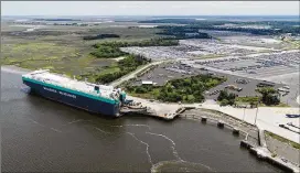  ?? COURTESY OF GEORGIA PORTS AUTHORITY ?? The Georgia Ports Authority and the Army Corps of Engineers signed a deal to launch the Brunswick Harbor Modificati­ons Project, a widening and realignmen­t of the channel for vehicle carrier ships entering and exiting the port.