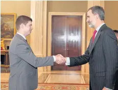  ??  ?? Honour Andrew Sweeney shook hands with Felipe VI of Spain