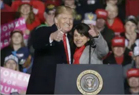  ?? MIKE ROEMER — THE ASSOCIATED PRESS ?? President Donald Trump and Republican Senate candidate Wisconsin State Sen. Leah Vukmir give a thumbs up during a rally Wednesday in Mosinee, Wis.