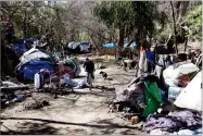  ?? AP PHOTO BY MARCIO JOSE SANCHEZ ?? In this 2014, file photo tents are set up along a pathway in the Jungle, a homeless encampment in San Jose.