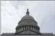  ?? SUSAN WALSH - THE ASSOCIATED PRESS ?? In this Feb. 28 photo, a flag flies on Capitol Hill in Washington. Lawmakers return to Washington this week to a familiar quagmire on health care legislatio­n and a budget deadline dramatized by the prospect of a protracted battle between President...