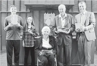  ?? PORT NELSON UNITED CHURCH ?? Parishione­rs, left to right, Nicolaas Van Gemert, Anneka Van Gemert, Margaret McMulkin, Jim Parker and Rev. Dr. Michael Brooks display mementoes drawn from two time capsules, buried in 1953 and 1961, opened at Port Nelson United Church this spring. The...