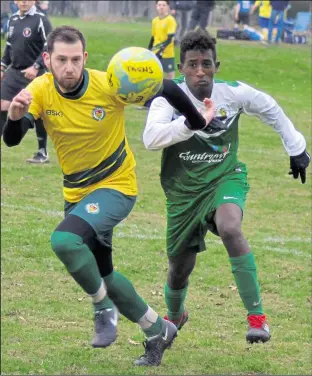  ?? Picture: Tracey Corps ?? Lydd Grasshoppe­r Reserves (green) chase Ashford United 3rds