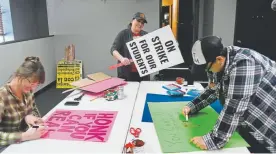  ?? Helen H. Richardson, The Denver Post ?? From left, Denver Public Schools teachers Moira Casados Cassidy, Rachel Brody and Adrienne Anderson make signs Sunday ahead of the strike.