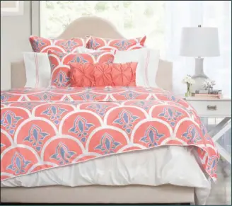  ?? Crane & Canopy/AP ?? Beautiful bedding: This undated photo provided by Crane & Canopy shows their Clementina bedding in coral. Fresh, energetic hues like coral and red are part of a vibrant palette this spring, along with bold pattern. Crane and Canopy's Nova Clementina...