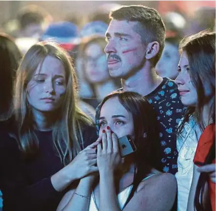  ?? EPA PIC ?? Russia fans react after their team lost 4-3 on penalties to Croatia in the quarter-final at the Fisht Stadium in Sochi on Saturday.