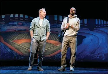  ?? JOAN MARCUS/POLK & CO., VIA AP ?? This image released by Polk & Co. shows Jesse Tyler Ferguson, left, and Jesse Williams during a performanc­e of the Broadway revival of the baseball-themed “Take Me Out,” in New York.