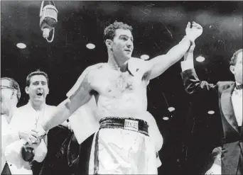  ?? AP PHOTO ?? Rocky Marciano, shown after knocking out Jersey Joe Walcott in the first round at Chicago Stadium, on May 15, 1953, is the subject of a new book by Mike Stanton.