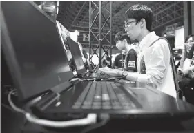  ?? BLOOMBERG VIA GETTY IMAGES ?? Young gaming enthusiast­s play online video games at a recent gaming expo in Japan.