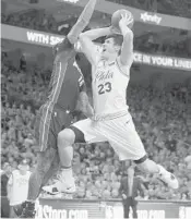  ?? MITCHELL LEFF/GETTY IMAGES ?? Philadelph­ia’s Ersan IIyasova goes up for a shot in the first quarter against Miami’s James Johnson.