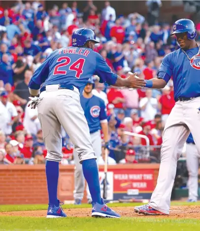  ?? | GETTY IMAGES ?? Jorge Soler celebrates with Dexter Fowler after his two-run homer in the second. Soler also doubled and walked twice.