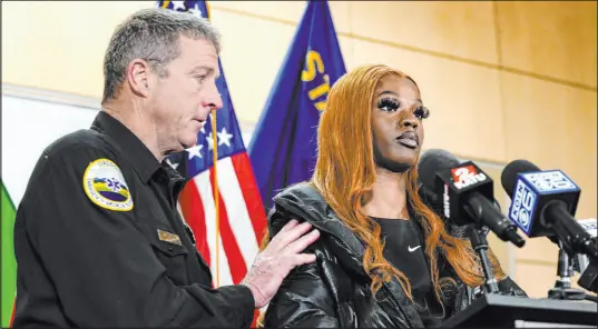  ?? Jenny Kane The Associated Press ?? Portland Fire and Rescue spokesman Rick Graves, left, praised Majiah Washington during a news conference Thursday, confessing he didn’t understand how she and the baby weren’t electrocut­ed after a power line fell on a parked car, killing three people.