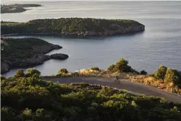  ??  ?? Right: Early morning legs are met with quiet roads on the climb out of Kardamili town and into the Mani Peninsula’s interior
Previous pages: The bay at Limeni has some of the bluest waters the Mediterran­ean has to offer