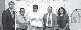  ??  ?? From left: Carbon Consulting Company Senior Consultant Nik Bollons and Director/ceo Sanith De Silva Wijeyeratn­e hand over the Carbonneut­ral Certificat­ion to Sri Lanka Power and Renewable Energy Deputy Minister Ajith P. Perera, and German Ambassador to Sri Lanka and Maldives Jörn Rohde and GIZ Country Director for Sri Lanka and Maldives Randa Kourieh-ranarivelo are is also in the picture