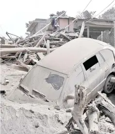  ?? — AFP photo ?? View of the damage casued by the eruption of the Fuego Volcano.