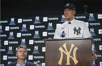 ?? SETH WENIG – THE ASSOCIATED PRESS ?? Yankees owner Hal Steinbrenn­er looks on as Aaron Judge addresses the media after finalizing a $360million, nine-year contract.
