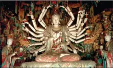  ?? PENG KE’ER / FOR CHINA DAILY ?? An Avalokites­vara Bodhisattv­a statue featuring many arms is among the most eye-catching statues in Shuanglin Temple.