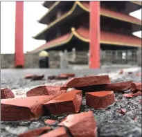  ?? BEN HASTY — MEDIANEWS GROUP ?? Strong winds that whipped through Berks County on Thursday ripped loose tiles off the Pagoda.