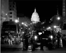  ?? MATT SLOCUM / ASSOCIATED PRESS ?? Members of the National Guard check vehicles Tuesday at a road block near the Capitol ahead Presidente­lect Joe Biden’s inaugurati­on ceremony.