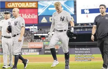  ?? AP ?? Trey Amburgey becomes latest Yankee outfielder to injure himself on Sunday night.