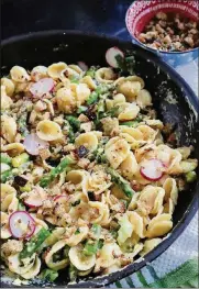  ?? PHOTOS BY GRETCHEN MCKAY / POST-GAZETTE ?? Cooked horseradis­h makes spring vegetable pasta sing when it is teamed up with green onions, garlic, radish and asparagus.
