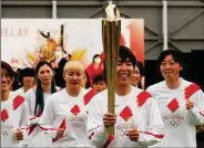  ??  ?? The torch relay sets out from Fukushima prefecture