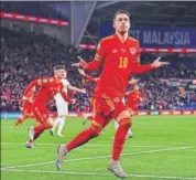  ??  ?? Aaron Ramsey celebrates scoring Wales's second goal.
AFP