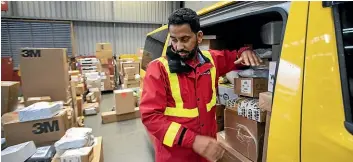  ?? Photos: ANDY JACKSON/ STUFF ?? NZ Post courier driver Manpreet Singh sorts parcels for delivery.