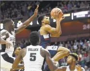  ?? John Woike / Associated Press ?? UConn guard Jalen Adams (4) seen here during an exhibition against Providence on Oct. 25.