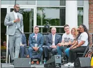  ??  ?? LeBron James gets a laugh from his mother, Gloria, right, and other officials at Monday’s opening ceremony for the I Promise School in Akron, Ohio. The I Promise School is supported by the The LeBron James Family Foundation and is run by the Akron...