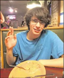  ??  ?? Alvaro made fast work of a plate of enchiladas, tamales and beans and rice at a Mexican restaurant in Oklahoma.