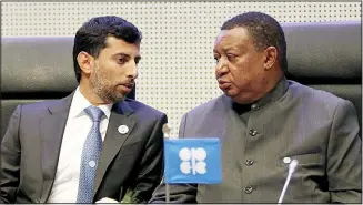  ?? (AP) ?? In this file photo, Minister of Energy of the United Arab Emirates, Suhail Mohamed Al Mazrouei talks with Mohammad Sanusi Barkindo, (from left), OPEC Secretary General of Nigeria prior to the start of a meeting of the Organizati­on of the Petroleum Exporting Countries (OPEC), at their headquarte­rs in Vienna, Austria.