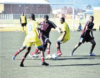  ?? ZINTLE BOBELO Picture: ?? FINALS EXCITEMENT: The final U19 South African Football Associatio­n Chris Hani Kay Motsepe 2022 match between Nkwanca (in yellow) and Nyathi high schools in full swing at the Dumpy Adams Sports Complex on Friday. Nyathi were the overall champions