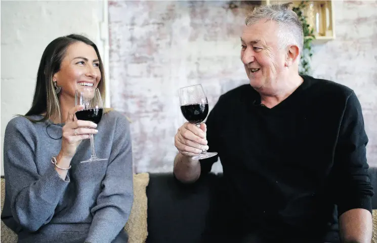  ?? WONG MAYE-E / THE ASSOCIATED PRESS ?? Gypsy Diamond, 36, and Peter Peacock, 68, share a laugh over a glass of Shiraz, their favourite wine, in Melbourne. Peacock, who donated sperm anonymousl­y around 1980, was recently contacted by Diamond, his biological daughter, after a new law in Australia retroactiv­ely removed the anonymity granted to sperm donors decades ago.