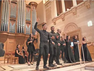  ?? MICHAEL SEARS / MILWAUKEE JOURNAL SENTINEL ?? Ars Longa de la Habana, a 16-member music ensemble from Cuba, performs Sunday at the Cathedral of St. John the Evangelist in Milwaukee, on the group’s first visit to the United States.