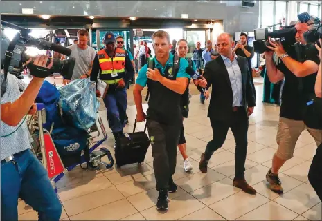  ?? Picture: EPA-EFE, NIC BOTHMA ?? HEADING FOR TURBULENCE: The controvers­ial David Warner departs from Cape Town Internatio­nal yesterday.