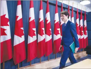  ?? CP PHOTO ?? Prime Minister Justin Trudeau leaves a press conference on his meeting with Alberta Premier Rachel Notley and B.C. Premier John Horgan on the deadlock over Kinder Morgan’s Trans Mountain pipeline expansion, in Ottawa on Sunday.