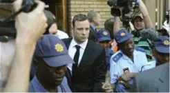  ??  ?? Oscar Pistorius leaves court yesterday in Pretoria, South Africa, after Judge Thokozile Masipa postponed proceeding­s until today. The Olympian is on trial for killing his girlfriend, Reeva Steenkamp.
