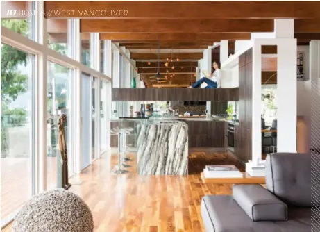  ??  ?? Warm Wood Over the past 50 years, many of the structural beams had been covered with drywall or damaged by water stains, and Ghorashi uncovered, cleaned and stained them to showcase the beams. The result is seen here in the kitchen (left, where...