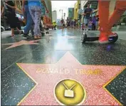  ?? Robyn Beck AFP/ Getty I mages ?? SINCE the 2016 presidenti­al campaign, President Trump’s star has been vandalized several times.