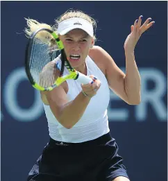  ?? VAUGHN RIDLEY / GETTY IMAGES ?? Caroline Wozniacki defeated Agnieszka Radwanska 6-3, 6-1 on centre court Thursday in Toronto.