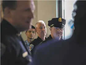  ?? Chloe Aftel / Special to The Chronicle ?? Officers listen to Mayor London Breed speak at the opening of the Police Department’s new office for beat cops patrolling the MidMarket area.