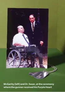  ??  ?? Mcgarity (left) and Dr. Swan, at the ceremony where the gunner received his Purple Heart