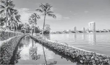  ?? DAMON HIGGINS USA TODAY NETWORK ?? Flooding along coastal Florida in Palm Beach County as a result of King Tide Sept. 29.