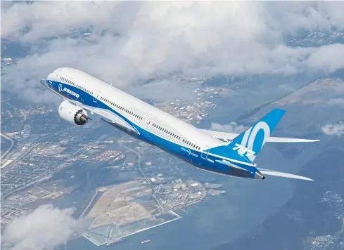  ?? BOEING CO VIA EPA ?? A handout photo shows the Boeing 787-10 Dreamliner, the third member of the 787 Dreamliner family, flying during its first flight.