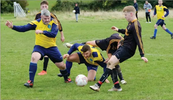  ??  ?? Glencormac’s Paul Devlin and Martin Sustovious against Carnew’s Conal McCrae.